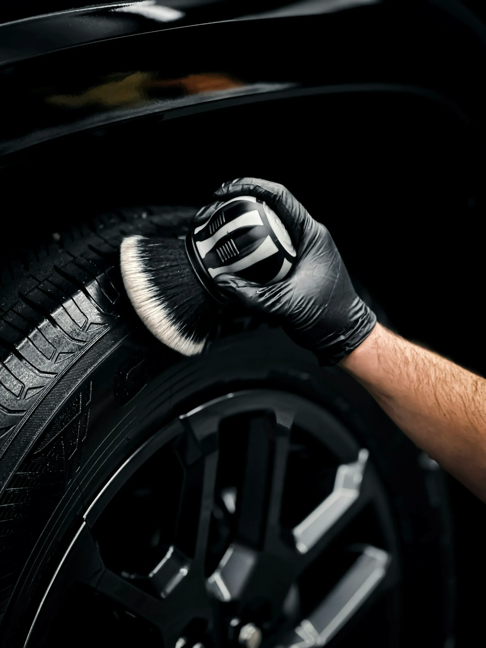 Detailing brush cleaning a tire